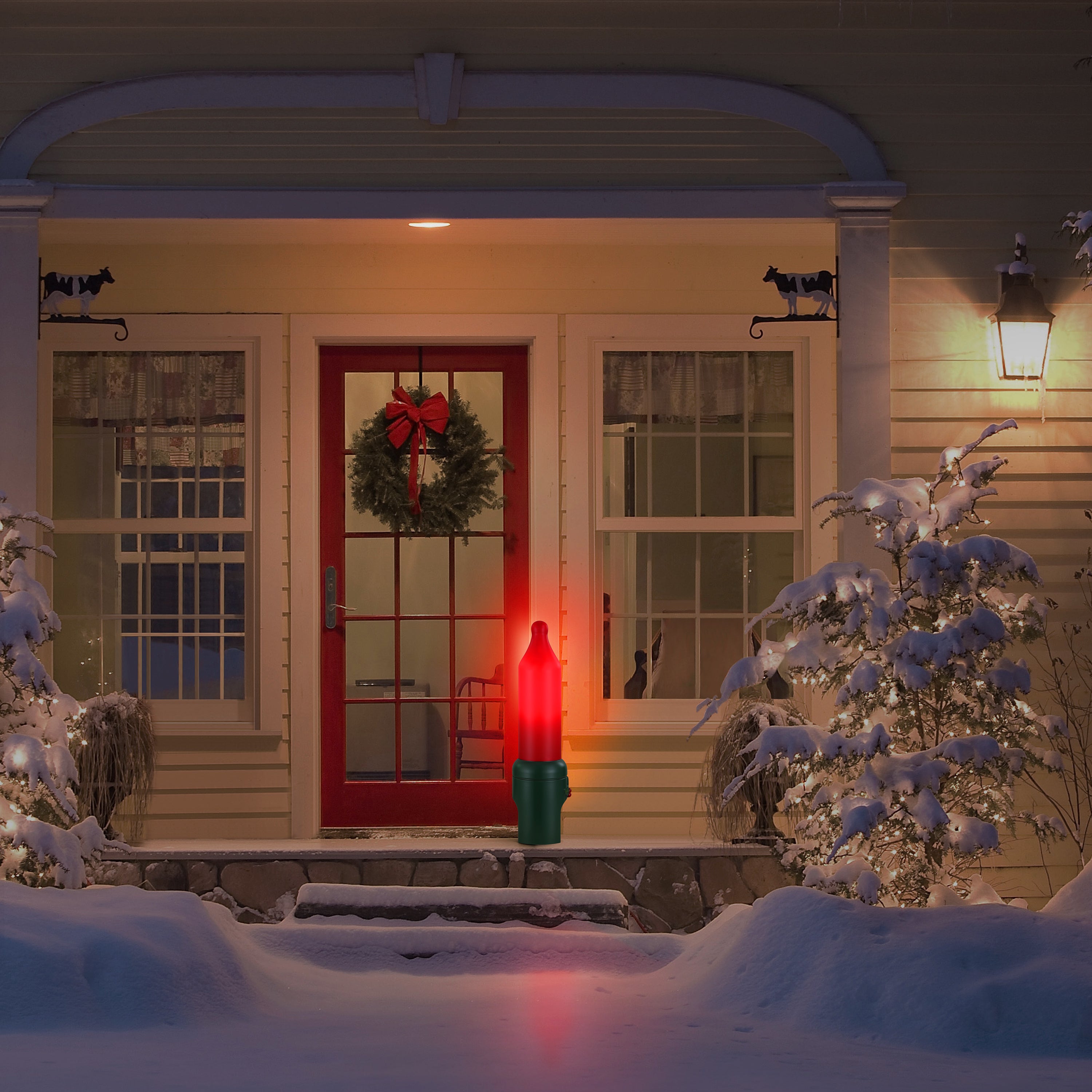 24 in. Red Blow Mold Bulb in a snowy front porch with a wreath on the door