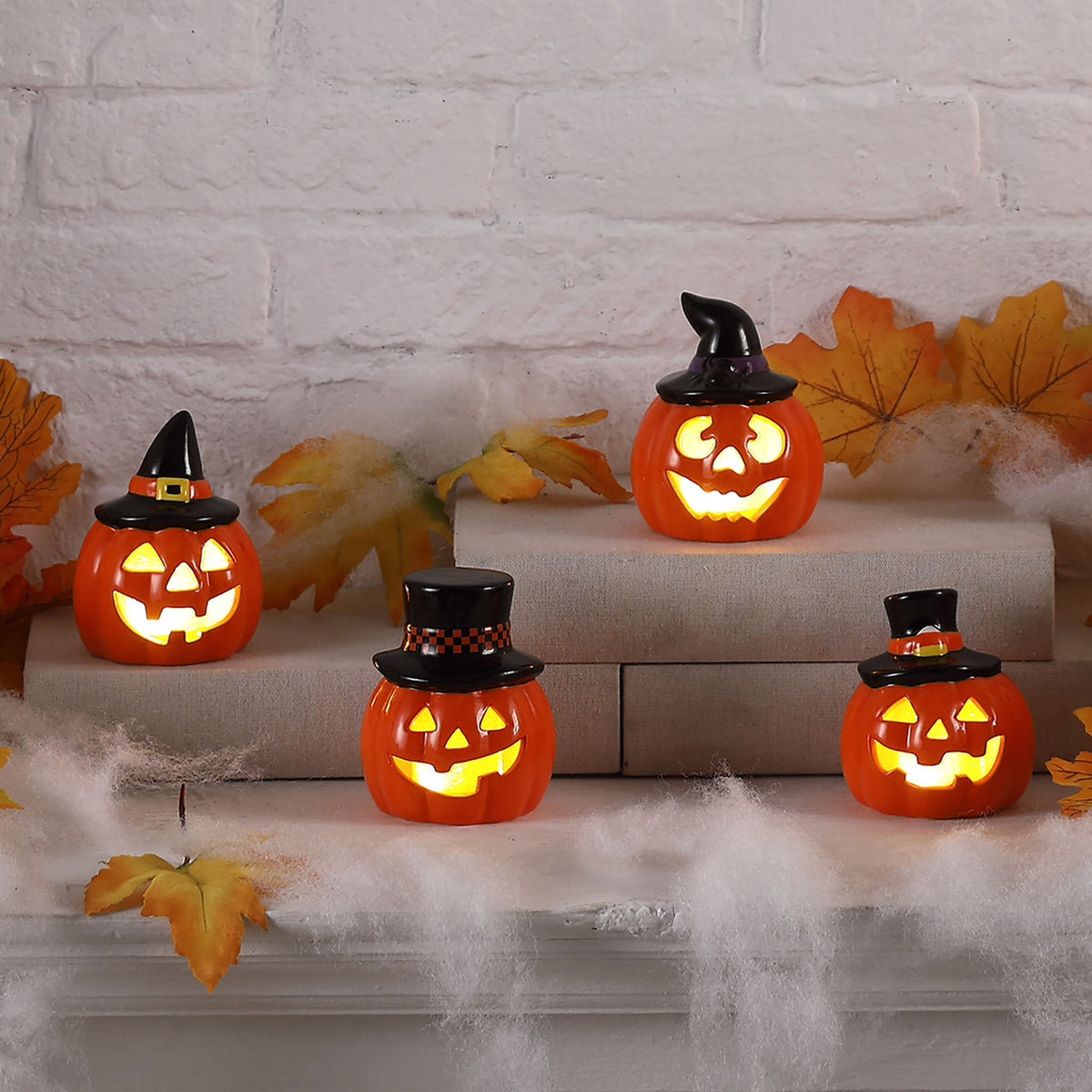 Mini Jack o lanterns in a Halloween background with leaves