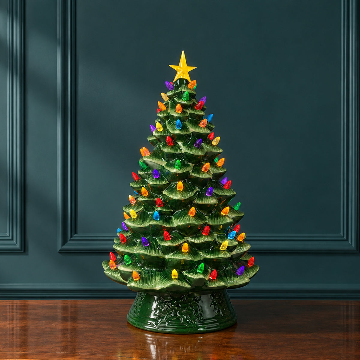 18 in. Nostalgic Ceramic Tree - Green on a wooden table with a teal wall in the background