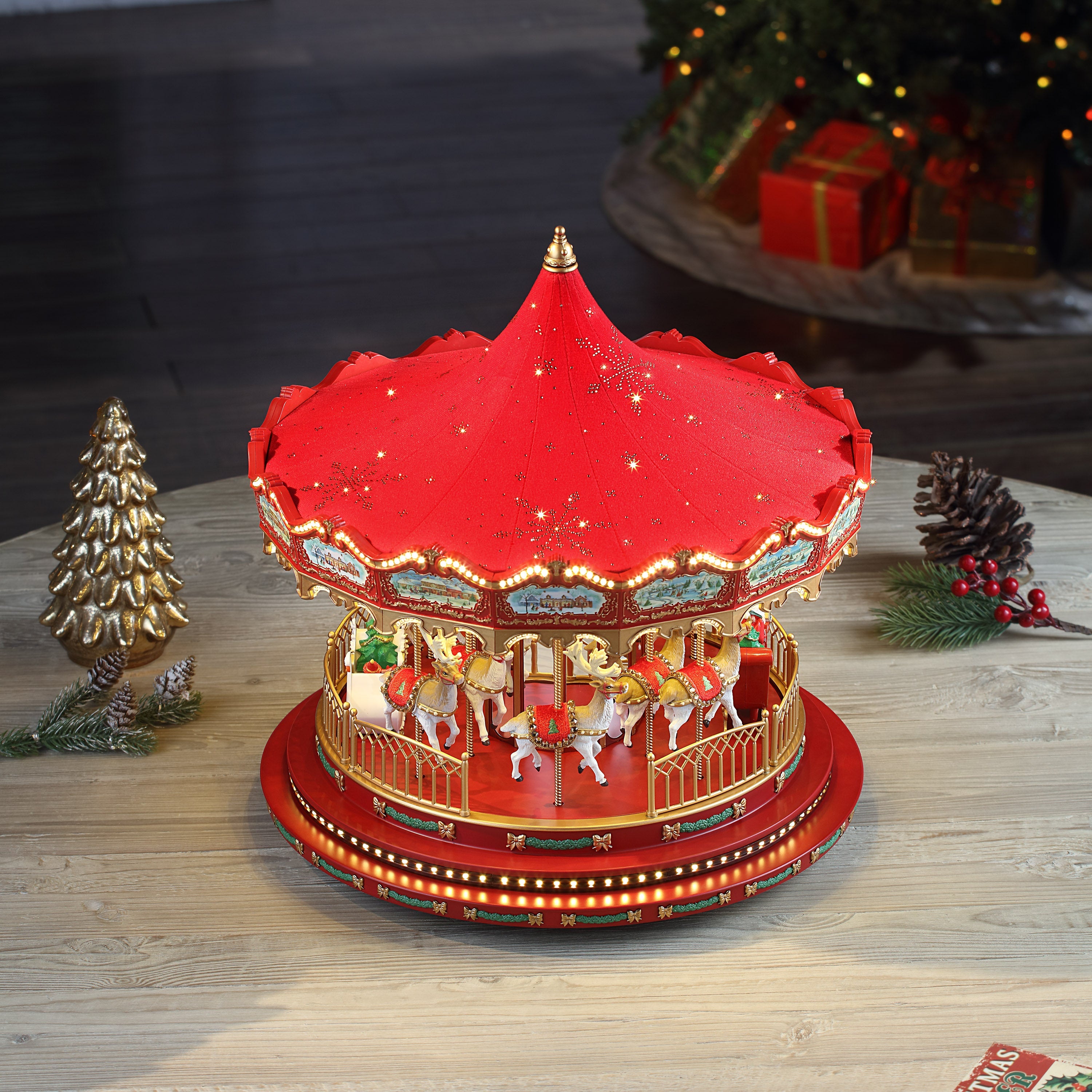 Canopy of Mr. Christmas 17 in. Animated Deluxe Crystal Carousel - Red lit up in a holiday display