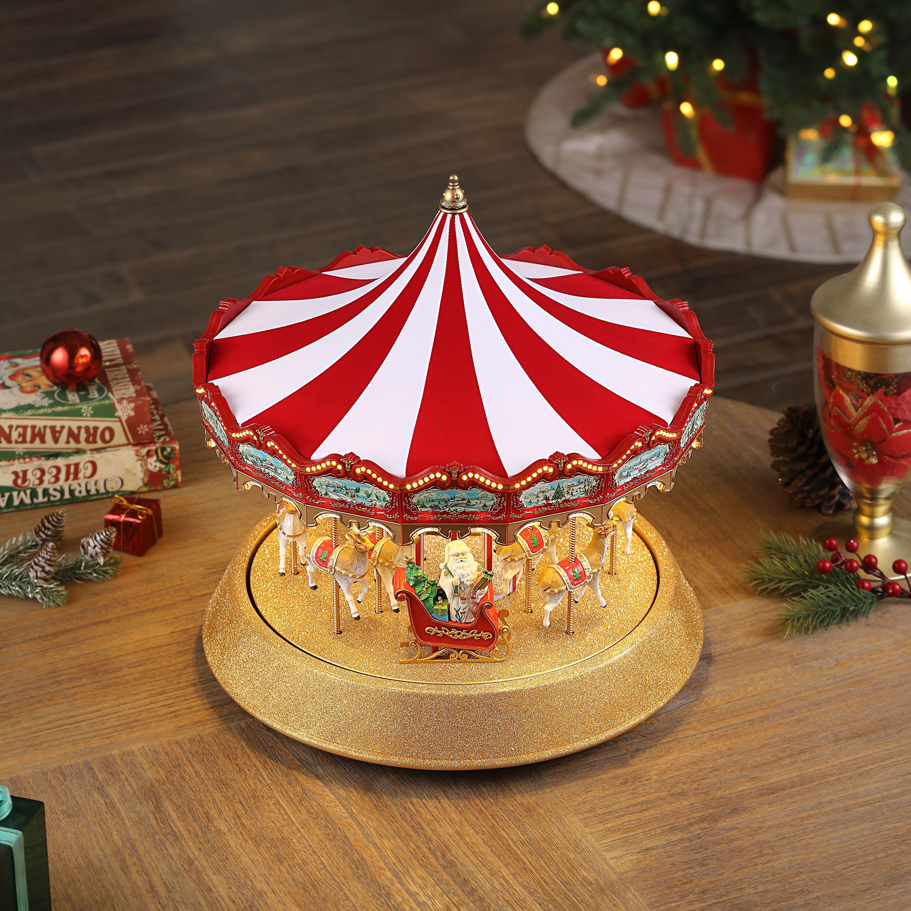 Top-down lifestyle view of the Mr. Christmas 17 in. Animated Sparkle Carousel showing the red and white canopy.