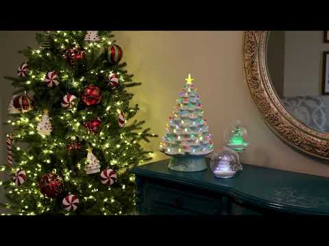 Load video: Video overview of the Mr. Christmas 18" Nostalgic Christmas Tree in pink, featuring ceramic construction, LED lights, and a glowing star topper.