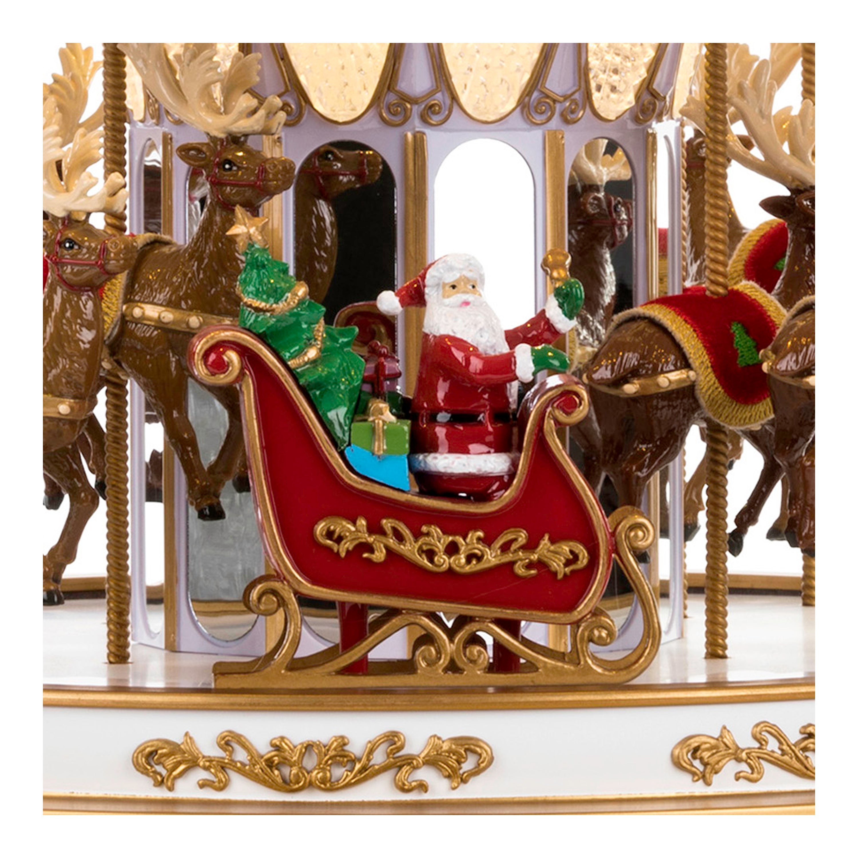 Close-up of Santa on his sleigh with a Christmas tree and presents on the 17" Regal Christmas Carousel by Mr. Christmas