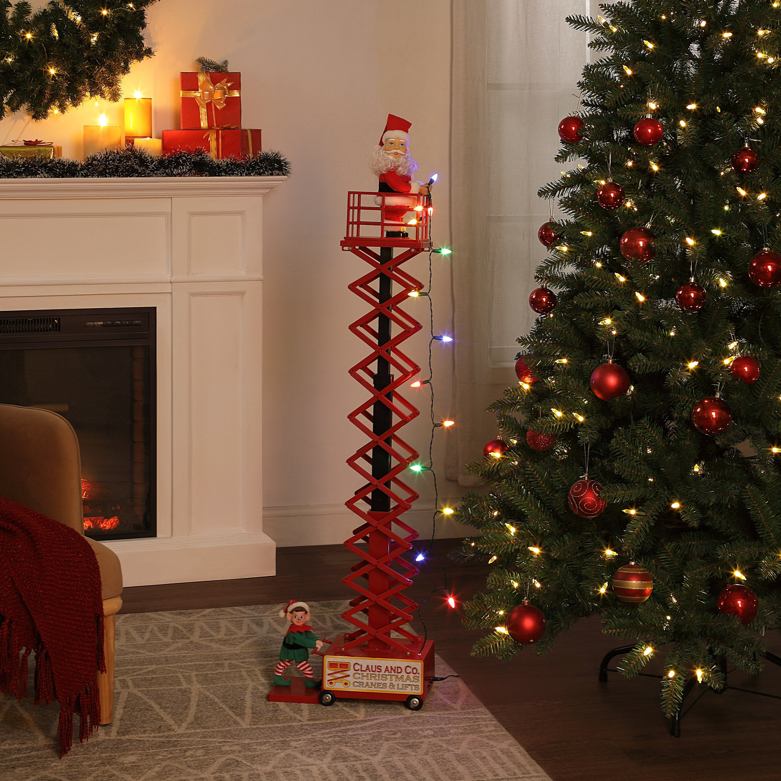 Mr. Christmas 50" Animated & Musical Santa's Lift - White lifestyle image with tree and fireplace in the background