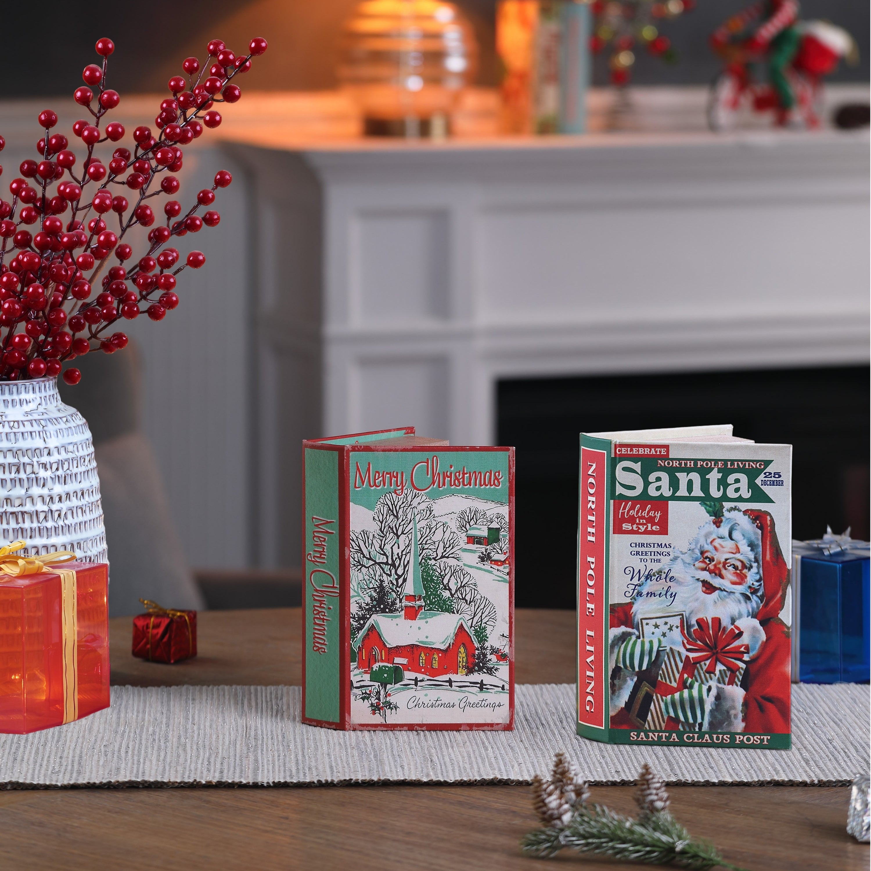 Two Christmas-themed books on a table with decorative items in the background