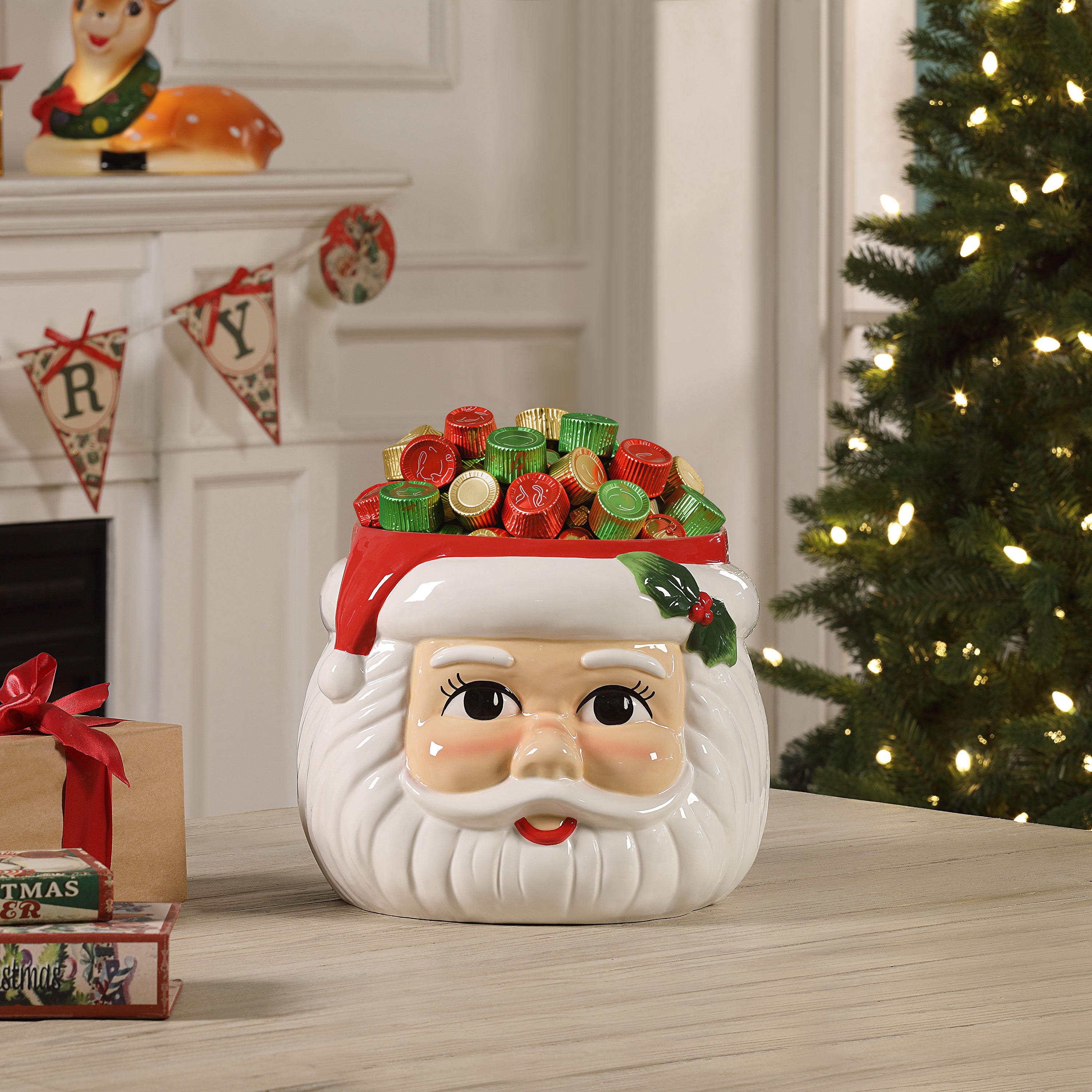 12 in. Ceramic Santa Candy Bowl on a table in a festive background