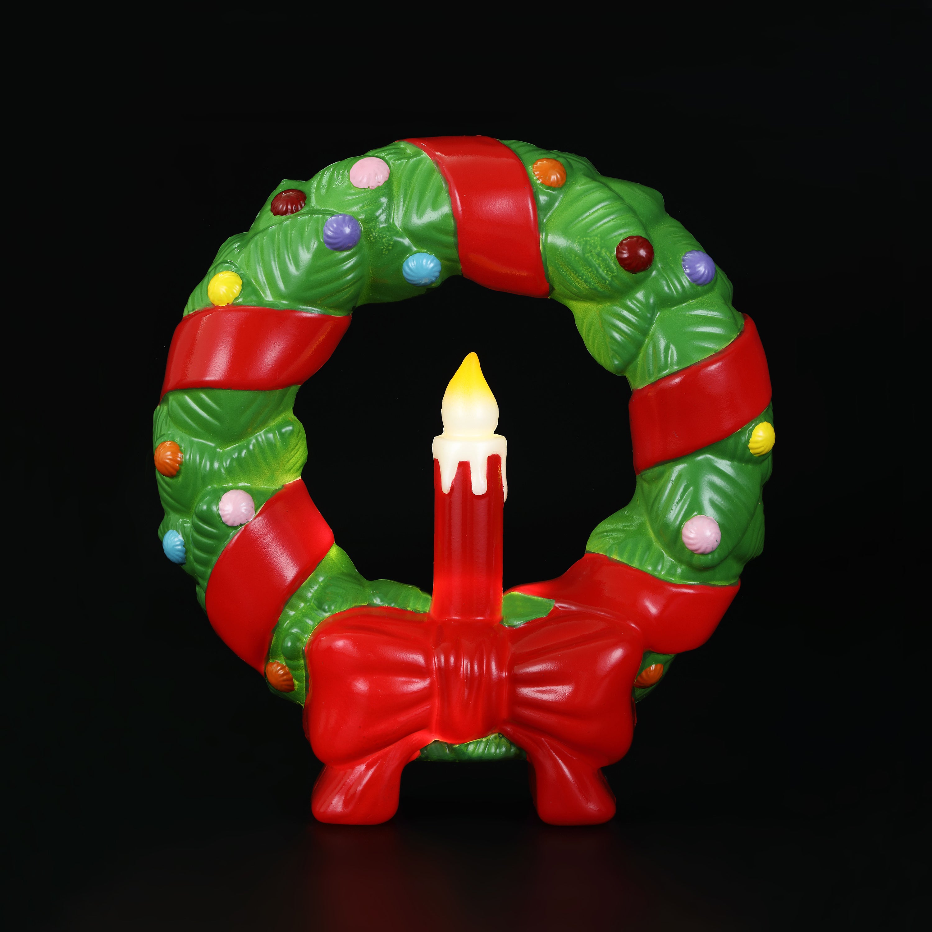 12 in. Lit Blow Mold Wreath with red ribbon and colorful lights on a black background