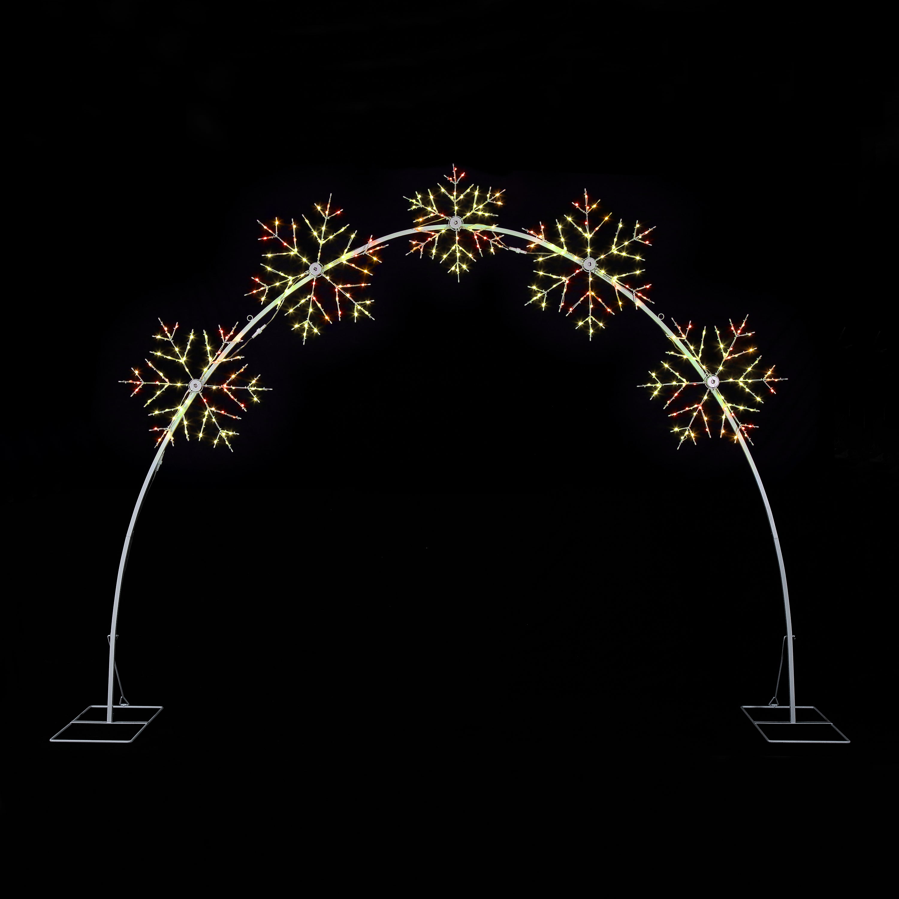 A white metal arch light fixture with five snowflake-shaped bulbs illuminated in warm white and orange-red tones, set against a solid black background.