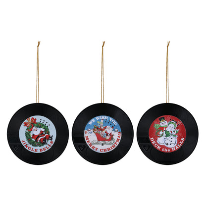 Three Christmas-themed vinyl record ornaments on a white background