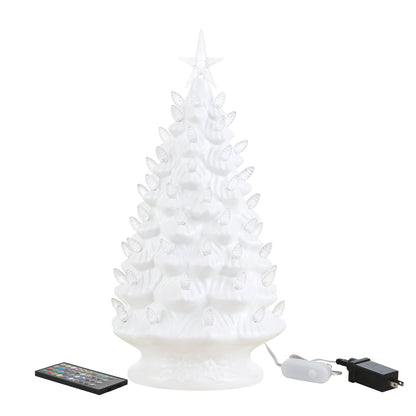 A white LED Christmas tree with a star topper, shown with its remote control and power adapter on a plain white background.
