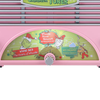 A pink Dr. Seuss-themed grinch  jammer tuner with a decorative front panel featuring illustrations of the Grinch, Whosquelette, and other characters, with a central dial control.
