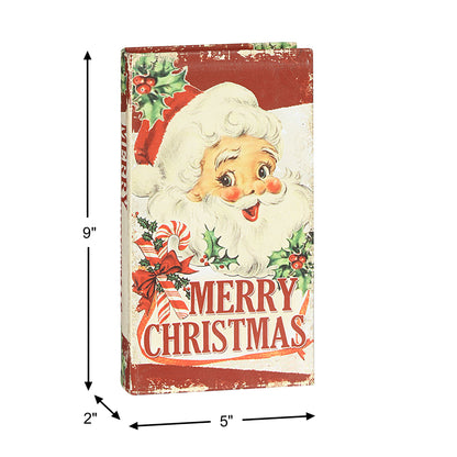 A vintage-style Christmas sign featuring a smiling Santa face with holly, candy canes, and the words “MERRY CHRISTMAS,” shown with dimension arrows indicating 9 inches tall, 5 inches wide, and 2 inches thick on a white background.