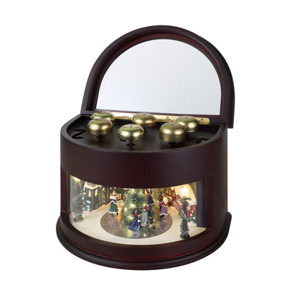 Decorative music box with a miniature scene inside on a white background