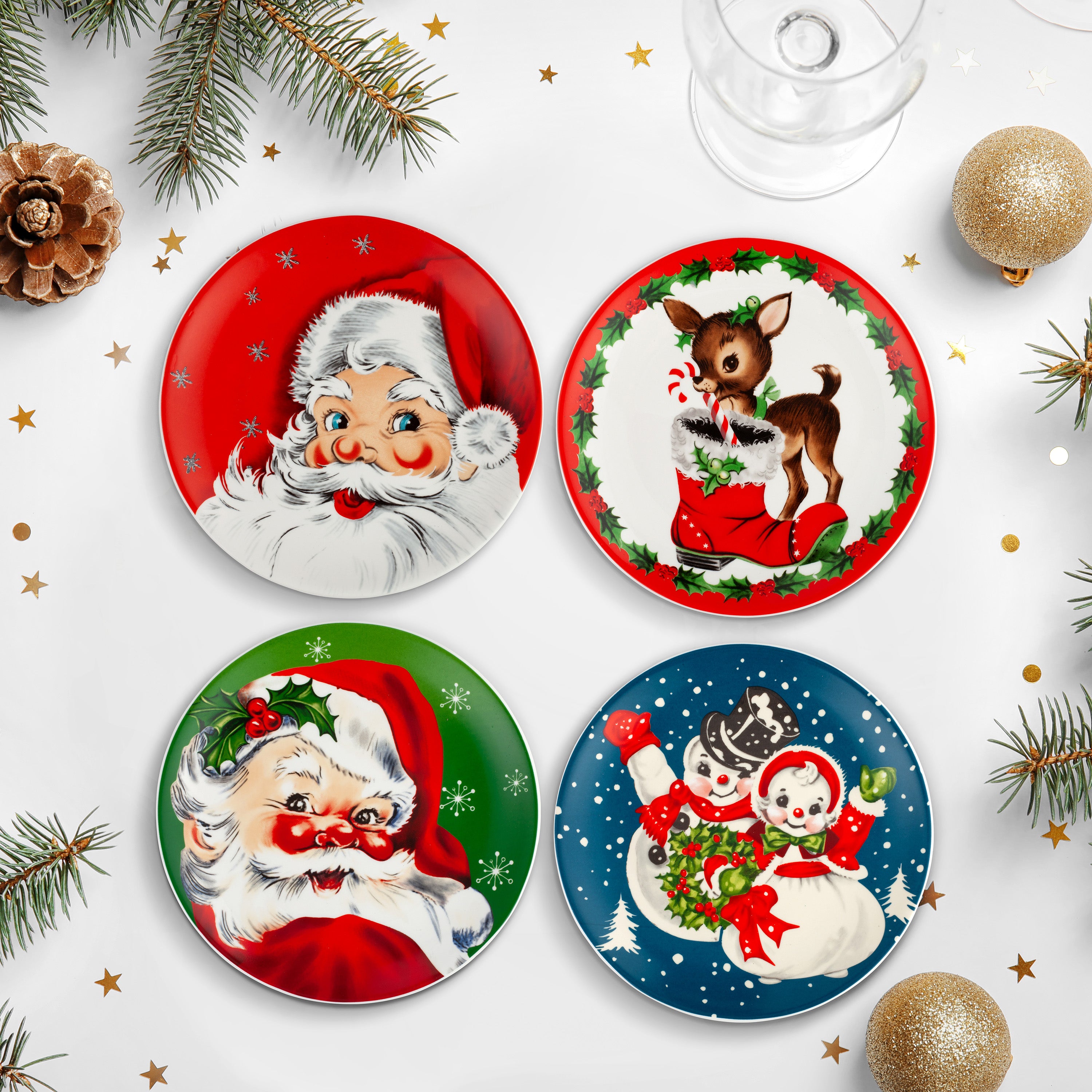 Set of four Christmas-themed plates featuring Santa Claus, a reindeer, and snowmen on a festive background.