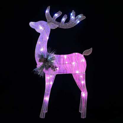 Mr. Christmas Fiber-Optic Reindeer glowing in purple with color-morphing LED lights against a dark black background.