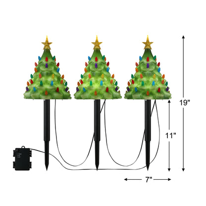 Dimensions for Mr. Christmas Blow Mold Pathway Trees showing each tree is approximately 9 inches tall by 7 inches wide, not including stake.