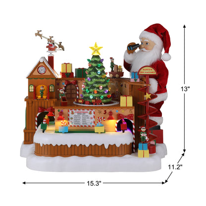 Dimensions of Mr. Christmas Animated Santa's Toy Factory Workshop showing 15.3 inches wide 11.2 inches deep and 13 inches tall
