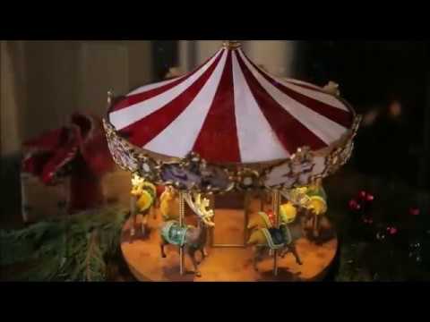 Load video: Video of Mr. Christmas Very Merry Carousel spinning with Santa and reindeer with holiday music playing
