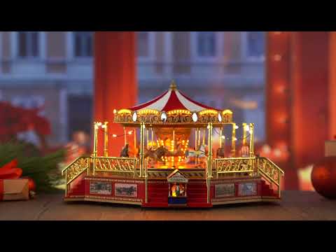 Load video: Mr. Christmas Animated &amp; Musical World&#39;s Fair Boardwalk Carousel Video Overview showcasing the carousel moving with lights and classic Christmas music