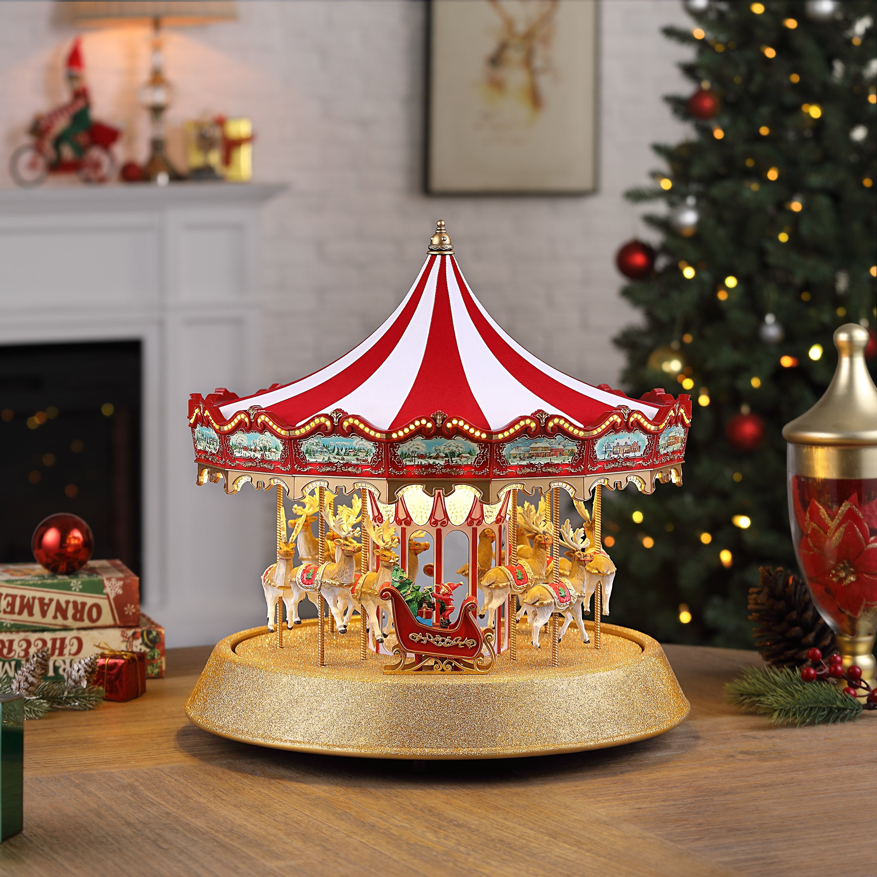 Mr. Christmas 17 in. Animated Sparkle Carousel next to a Christmas tree showcasing reindeer and elf in sleigh