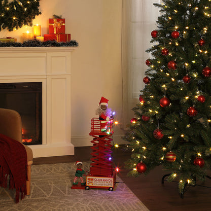 Mr. Christmas 50" Animated & Musical Santa's Lift Collapsed - Black Santa lifestyle image with Christmas tree and fireplace in a festive background