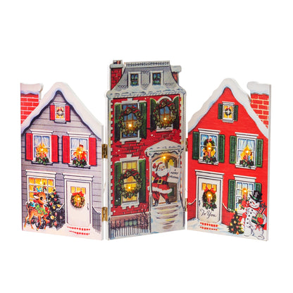 Front view of the Mr. Christmas 15" Illuminated Folding Village Scene fully opened and lit, shown on a white background.