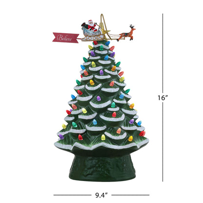 Side view of 16-inch ceramic Christmas tree with snowy tips and animated Santa sleigh topper