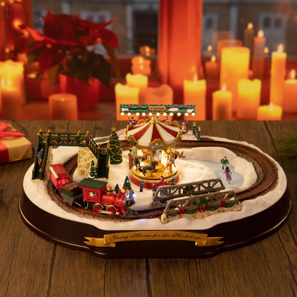 Mr. Christmas Animated & Musical Going Home for The Holidays decor piece on a tabletop with a festive background of candles and a poinsettia plant