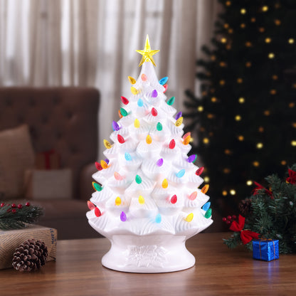 Mr. Christmas 24 inch nostalgic tree displayed on table with LED lights and illuminated star