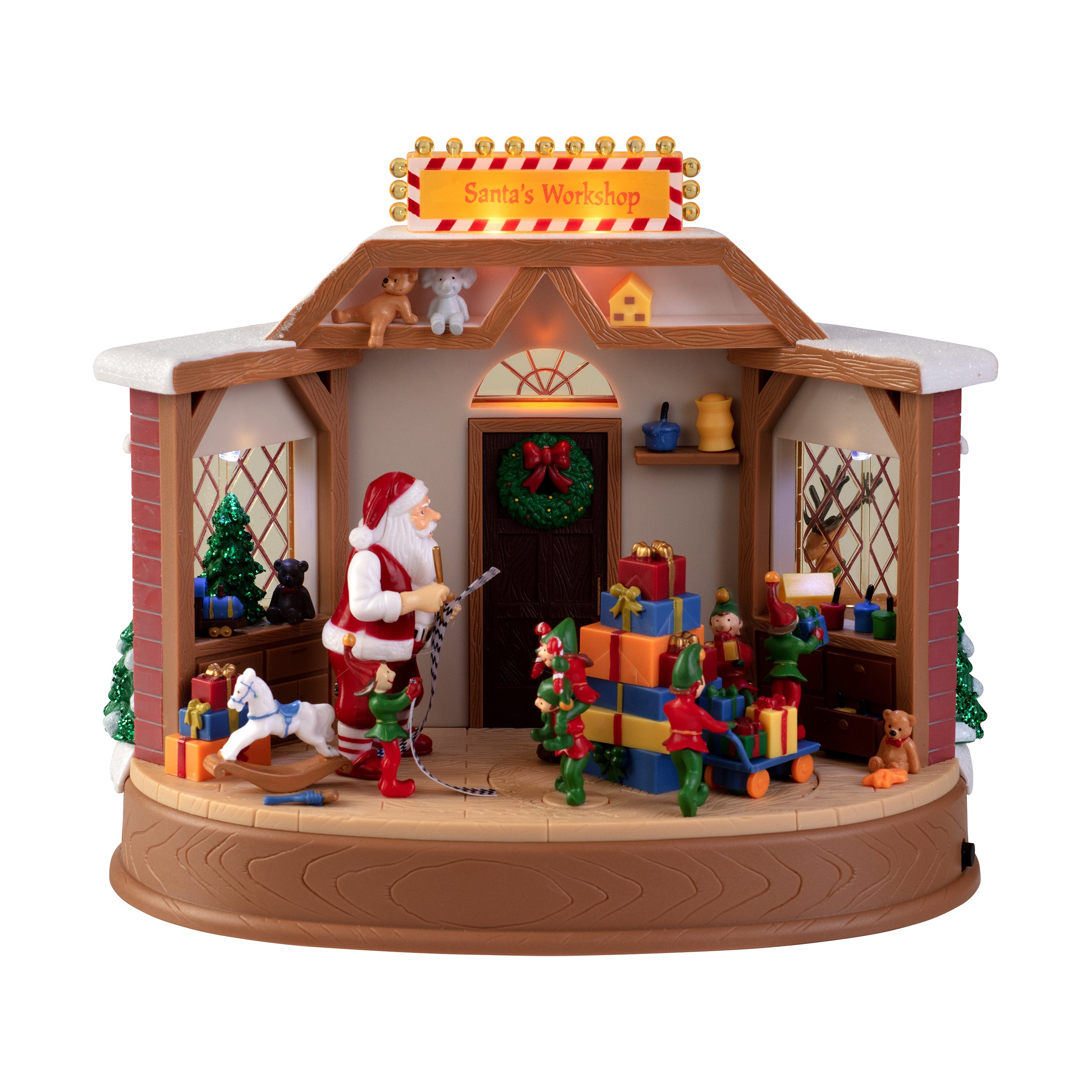 Animated Santa’s Workshop village scene with rotating Santa and elves, multicolored LED lights, and glittery trees
