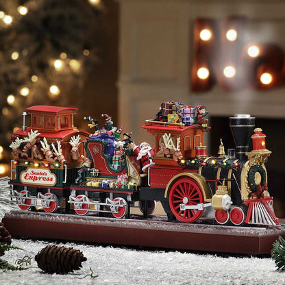 mr. christmas santas express train displayed in snowy holiday scene with led lights and animation