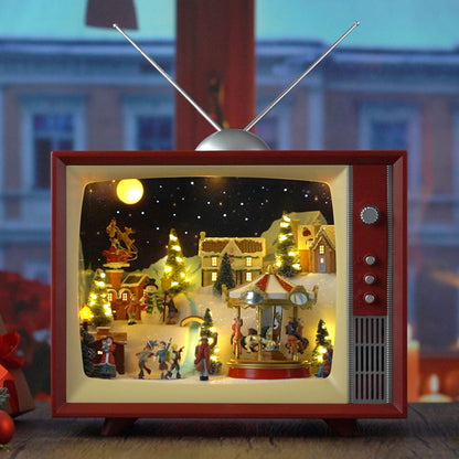 Mr. Christmas Animated Vintage Television displayed on a windowsill with a city building backdrop
